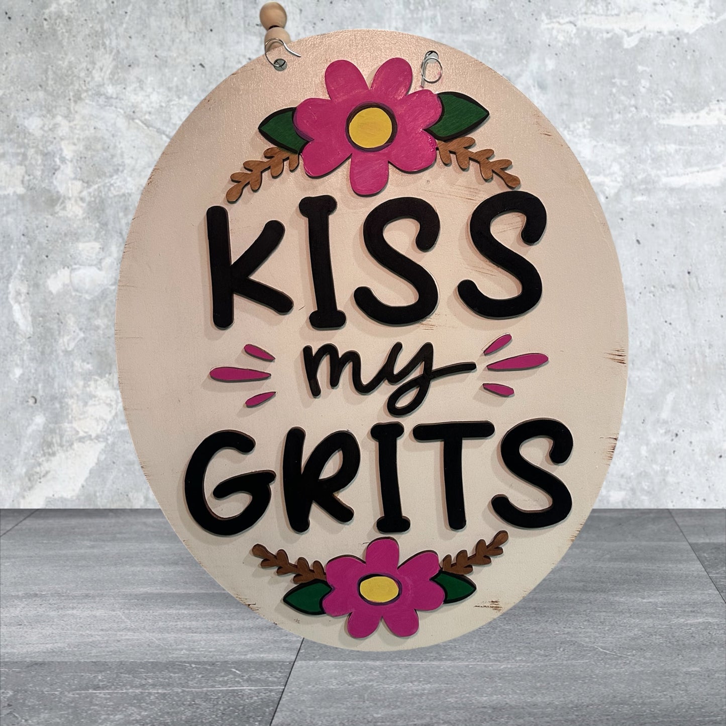 Vintage hand-painted wood door hangers, made to order in Iowa. Choose from fun farmhouse, sassy, and seasonal designs — perfect for porch or gift.