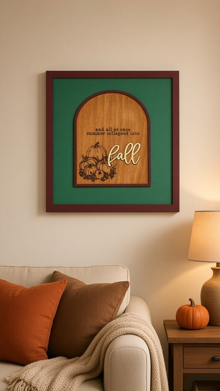 Squiggle Laser and Design wooden arch wall sign with pumpkin art and fall typography hanging above a cozy sofa.