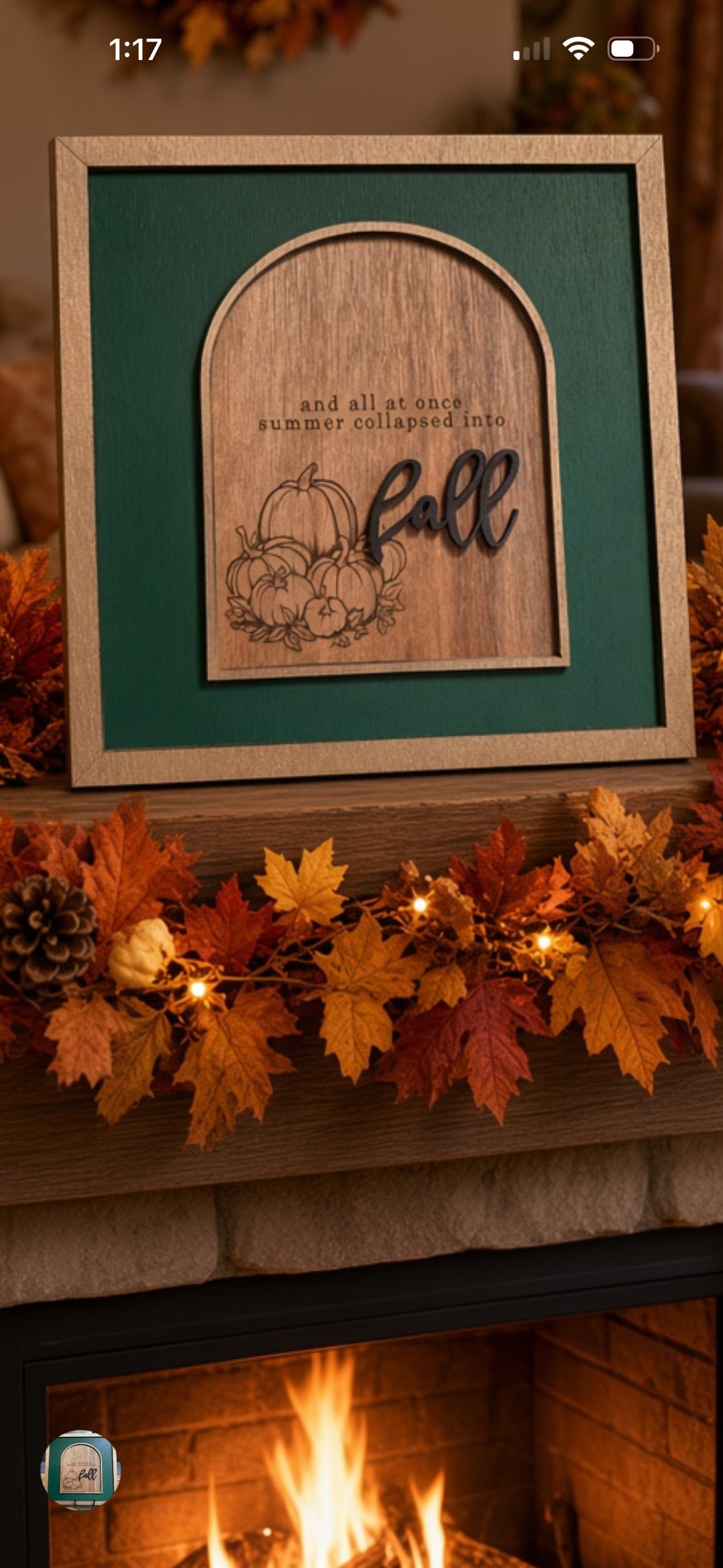 Squiggle Laser and Design wooden arched wall sign with pumpkin art and fall typography on a fireplace mantel